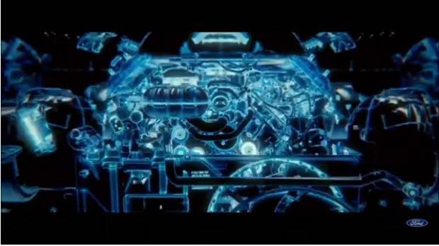 На видео видны двигатель V8 и остальные части подкапотного пространства, горящие в цвете Tron-esque, характерном именно для электрифицированных моделей Ford.